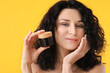 © Pixel-Shot - Beautiful young woman with cream on color background
