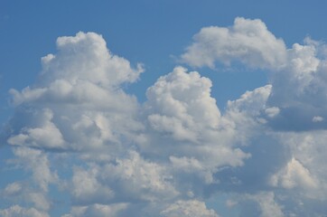 white cloud shapes on blue summer sky