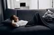 © SHOTPRIME STUDIO - woman lies on sofa and soft pillow interior