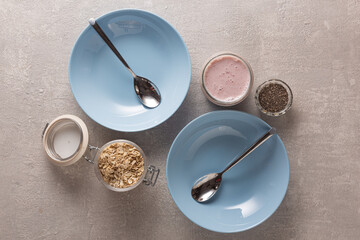 Wall Mural - Healthy breakfast on blue plates, top view