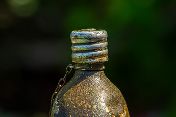 Old military flask for water on a sunny day, photo for design