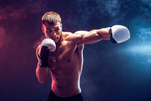Shirtless Boxer With Gloves On Dark Background. Isolate