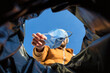 Point of view shot of man throwing away surgical mask in trash can