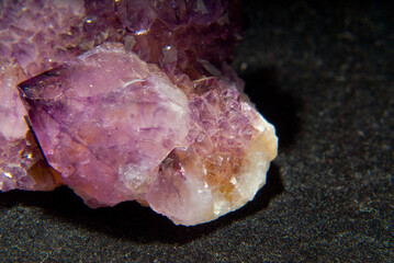 Sticker - Closeup shot of a Rose quartz isolated on a black background