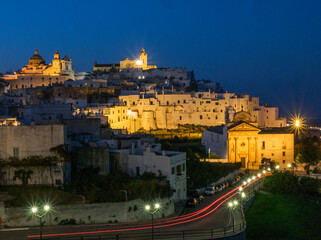 Wall Mural - The picturesque old town of Ostuni in southern Italy, built on top of a hill and crowned by its Gothic Basilica or Cathedral in the evening.