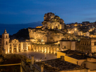 Poster - The Roman Catholic church of Santa Maria de Idris, cut into the rock in Matera at night.