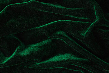 Emerald suede fabric in a fold. Texture, background