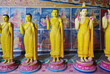 Yellow buddhistic statues. Buddhas in Sri Lanka. Buddhistic temple in Asia.