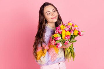 Canvas Print - Portrait of attractive dreamy girl holding in hands smelling bunch tulips mom mother day event isolated over pink pastel color background