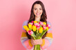 © deagreez - Portrait of pretty cheerful girl holding in hands bunch tulips mom mother day event isolated over pink pastel color background