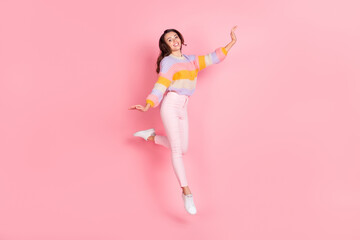 Poster - Full length body size view of pretty skinny cheerful girl jumping dancing having fun isolated over pink pastel color background