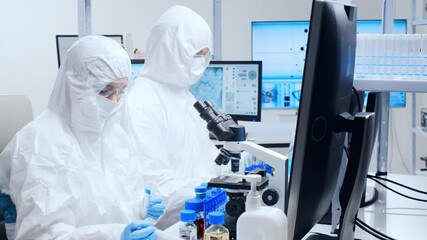 Wall Mural - professional team of scientists is working on a vaccine in a modern scientific research laboratory. 
