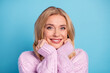 © deagreez - Photo portrait of blonde woman smiling lovely wearing warm winter knitted sweater isolated vibrant blue color background