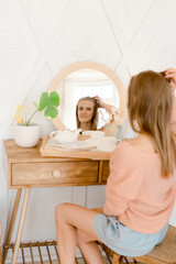 Wall Mural - Portrait of a young woman relaxing at home