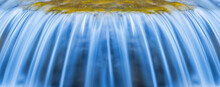 Closeup Waterfall On A Mountain River, Beautiful Spring Rushing Water Background