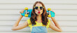 © rohappy - Portrait of young woman with green skateboard on a white background