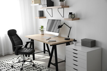 Poster - Comfortable office chair near table with modern computer