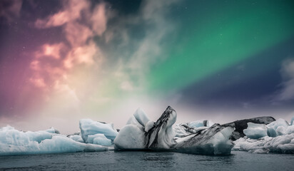 Wall Mural - Northern lights aurora borealis over Jokulsarlon glacier ice lagoon in Iceland