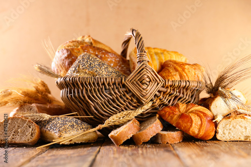 bread and croissant on wood background © M.studio