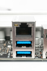 usb 2.0 type-a and lan ports on a computer motherboard on white background