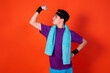 © Denis - Funny young man and retro style. Sports and recreation. Bright colors. Orange background.