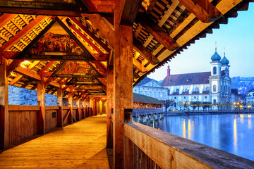 Wall Mural - View through historical wooden Chapel Bridge to the old town of Lucerne, Switzerland