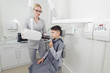© lisovoy - Dentist hands make jaw x-ray image for little boy in dental clinic