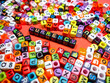 © Mohd Azrin - Selective focus.Colorful dice with word CURRENCY on red background.Shot were noise and film grain.