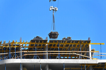 Crane and highrise construction site