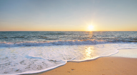 Wall Mural - Sandy seashore at sunset.