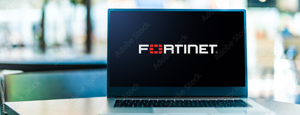 Laptop computer displaying logo of Fortinet Stock Photo | Adobe Stock