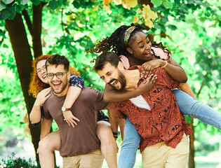 Wall Mural - young people having fun happy group friendship student lifestyle piggyback youth teamwork together