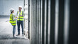 © Pitchayaarch - Staff workers in yellow vests and safety helmets inspecting inside of empty shipping container for import and export cargo.