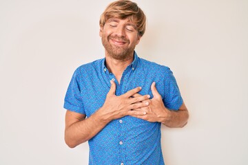 Poster - Young blond man wearing casual clothes smiling with hands on chest, eyes closed with grateful gesture on face. health concept.