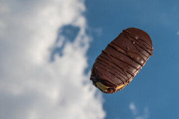 Sweets photographed on a mirror reflecting the sky