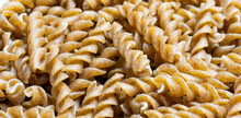 wholemeal pasta with visible details. background or textura