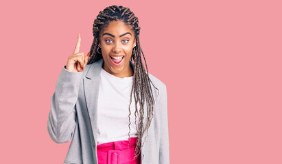 Sticker - Young african american woman with braids wearing business clothes pointing finger up with successful idea. exited and happy. number one.