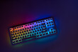 Gaming keyboard with RGB light. White mechanical keyboard. Gamer's workspace, neon light.