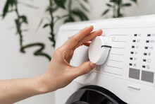 Woman Washing Laundry Using Modern Automatic Machine