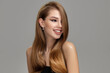 © Alena - Young beautiful woman with a happy smile and long shiny hair. Perfect hairstyle and makeup