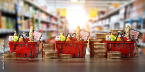 Growth of food sales or growth of market basket or consumer price index concept. Shopping basket with foods with coin stacks in grocery shop. © Maksym Yemelyanov