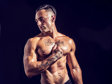 Handsome Muscular Shirtless Young Man Standing Confident, Profile View, Looking Down