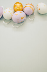 Wall Mural - Closeup shot of decorative Easter eggs on a white surface - copy space