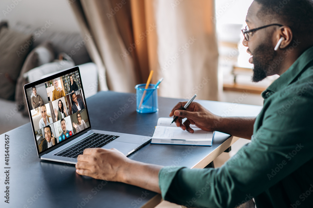 Online business briefing. Male African American employee speak on video call with diverse multiracial colleagues, on laptop screen diverse business people, meeting online, group brainstorm - obrazy, fototapety, plakaty 