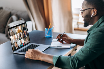 online business briefing. male african american employee speak on video call with diverse multiracia
