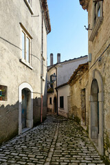 An alley between the old stone houses of Sassinoro, a medieval village in the province of Benevento.