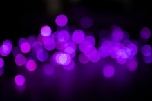 Bright Purple Bokeh Lights On Black Background