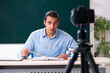 © Elnur - Young handsome teacher recording video for his blog