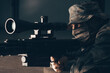 © andy_gin - The sniper lies and aims through the telescopic sight.