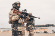 © andy_gin - Soldier of a special forces group stands with a heavy machine gun. Special operations concept. SWAT.